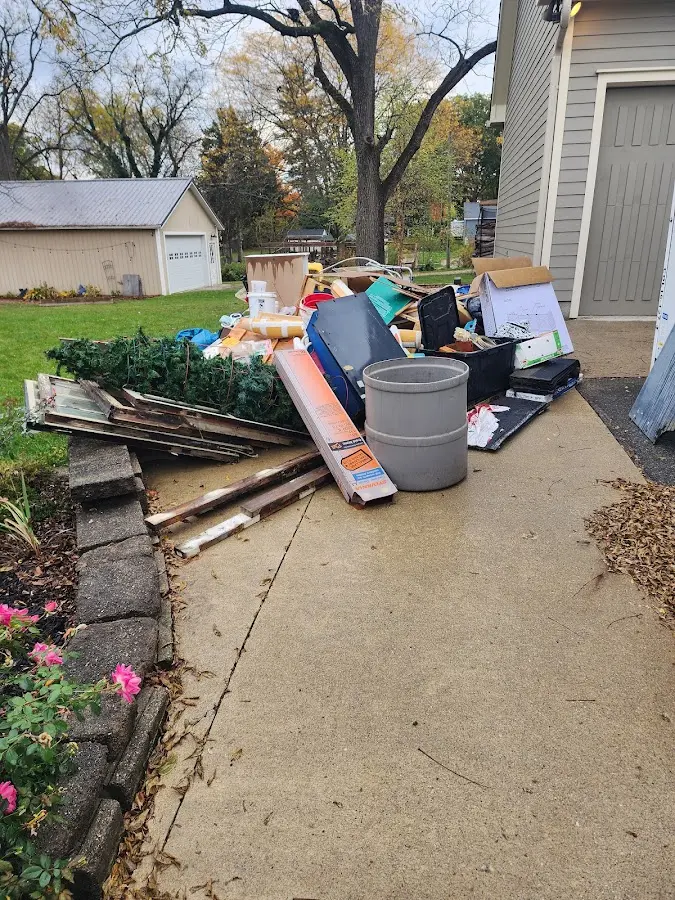 Dumpster being loaded with debris for Residential Dumpster Rental in Bridgewater